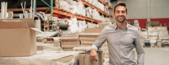 Smiling man in warehouse